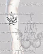 Angel and devil cherry tattoo stencil shown on forearm with paired cherries, long stems, flaming background, halo, horns, wings, and pointed tail