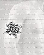 Animal print rose tattoo shown on men’s arm placement with bold spotted petals and shaded leaves