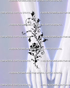 Artistic rose vine tattoo shown across the hand and wrist with curved botanical stems, rosebuds, open rose petals, and expressive black ink linework
