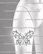 Baroque filigree butterfly tattoo shown on a woman’s thigh with large symmetrical wings, open acanthus curls, bead accents, and a hanging jewel