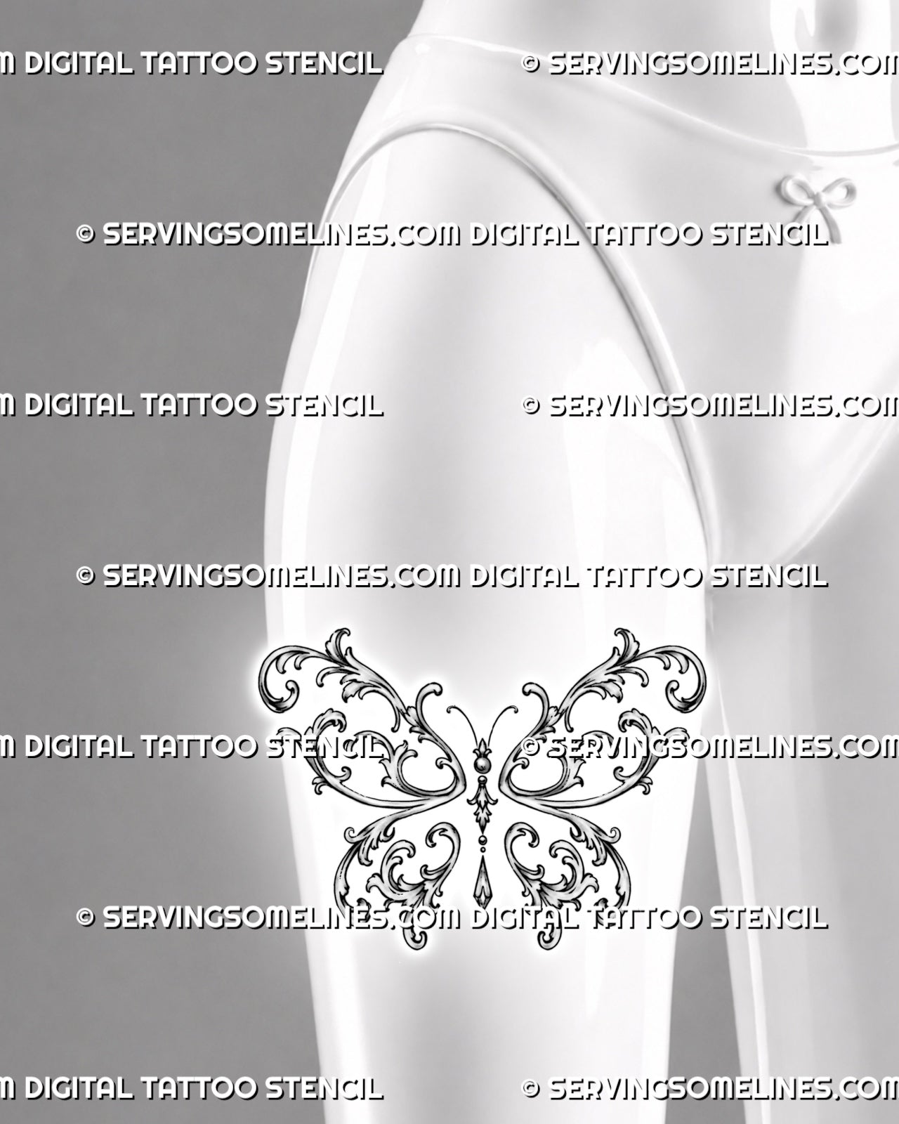 Baroque filigree butterfly tattoo shown on a woman’s thigh with large symmetrical wings, open acanthus curls, bead accents, and a hanging jewel