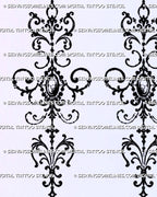 Close-up of Baroque filigree tattoo details with oval pendant-like centre, curling blackwork scrolls, dotted accents, pointed star, and hanging teardrop ornament