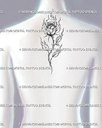 Burning rose tattoo shown at the upper-back center with flaming petals, fire-shaped leaves, a thorned stem, and elongated botanical flow