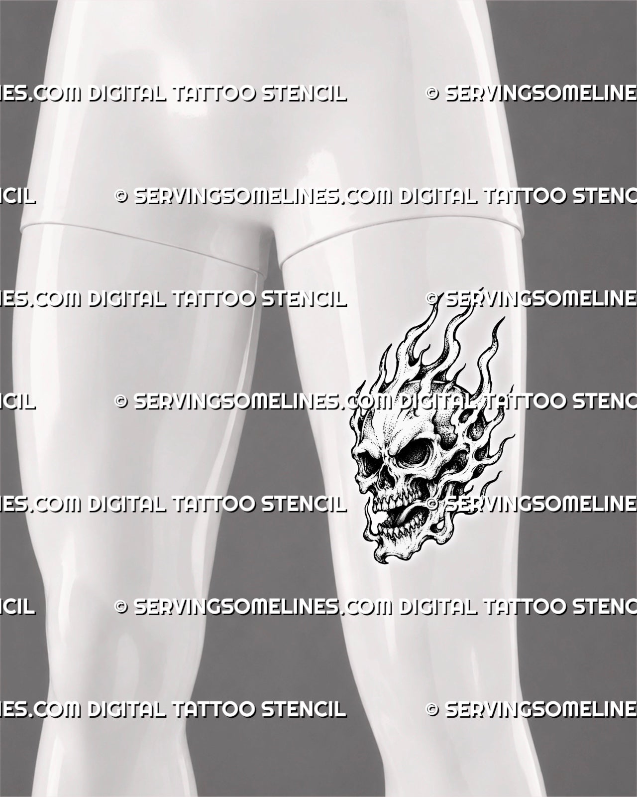 Burning skull tattoo shown on a man’s front thigh with exposed teeth, dark facial cavities, tall crown flames, curling side fire, and a vertical composition