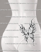 Butterfly flame tattoo shown on a woman’s lower-back hip with open wings, trailing fire shapes, asymmetrical movement, and layered black-and-grey details