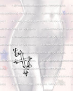 Cross with butterfly tattoo shown on womens hip placement, with a vertical shaded cross shape and two soft butterfly details.