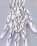 Cybersigilism hand tattoo stencil shown across the back of the hand with connected wrist-to-finger linework, pointed cyber tribal forms, and open negative space