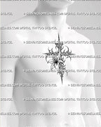 Cybersigilism lily cross tattoo stencil shown on men’s sternum placement with spiked cross frame and centered lily detail 