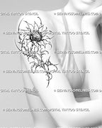 Cybersigilism sunflower tattoo shown on a woman’s upper arm with pointed petals, thorn-like stem details, abstract leaves, and dark botanical linework