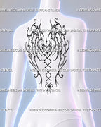 Dark feminine gothic wings tattoo shown from a female side view with shoulder-blade framing, thorn-like fantasy wings, heart center, and lace-up spine detail