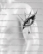 Gothic eye tattoo preview on men’s upper arm, with spiderweb frame, scratch-like texture, sharp lashes, and hanging spider.
