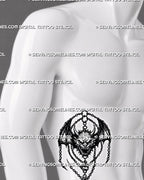 Dark medieval demon tattoo stencil shown on men’s ribs with winged devil flash shape, horned face, chains, and vertical placementv