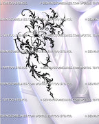 Dark romantic floral tattoo shown across a woman’s front shoulder near the collarbone with an open lily, baroque scrolls, celestial stars, and feminine ornamental blackwork