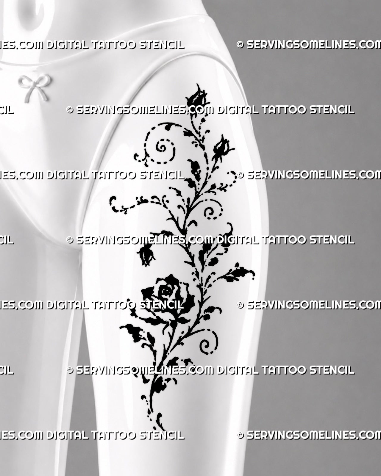Dark romantic rose vine tattoo shown on a woman’s thigh with open rose, trailing rosebuds, spiral botanical curls, and loose artistic black ink details