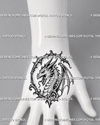 Dragon head tattoo stencil shown on hand with horned dragon face, open jaw, sharp teeth, scale detail, and compact gothic frame