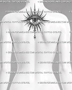 Evil eye tattoo preview on women’s upper back behind the neck, with radiant spikes, dotted shading, star pupil, and drop ornament.
