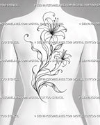 Feminine lily back tattoo shown from women’s upper back to mid back with two blooms, a flower bud, flowing stems, and long botanical leaves