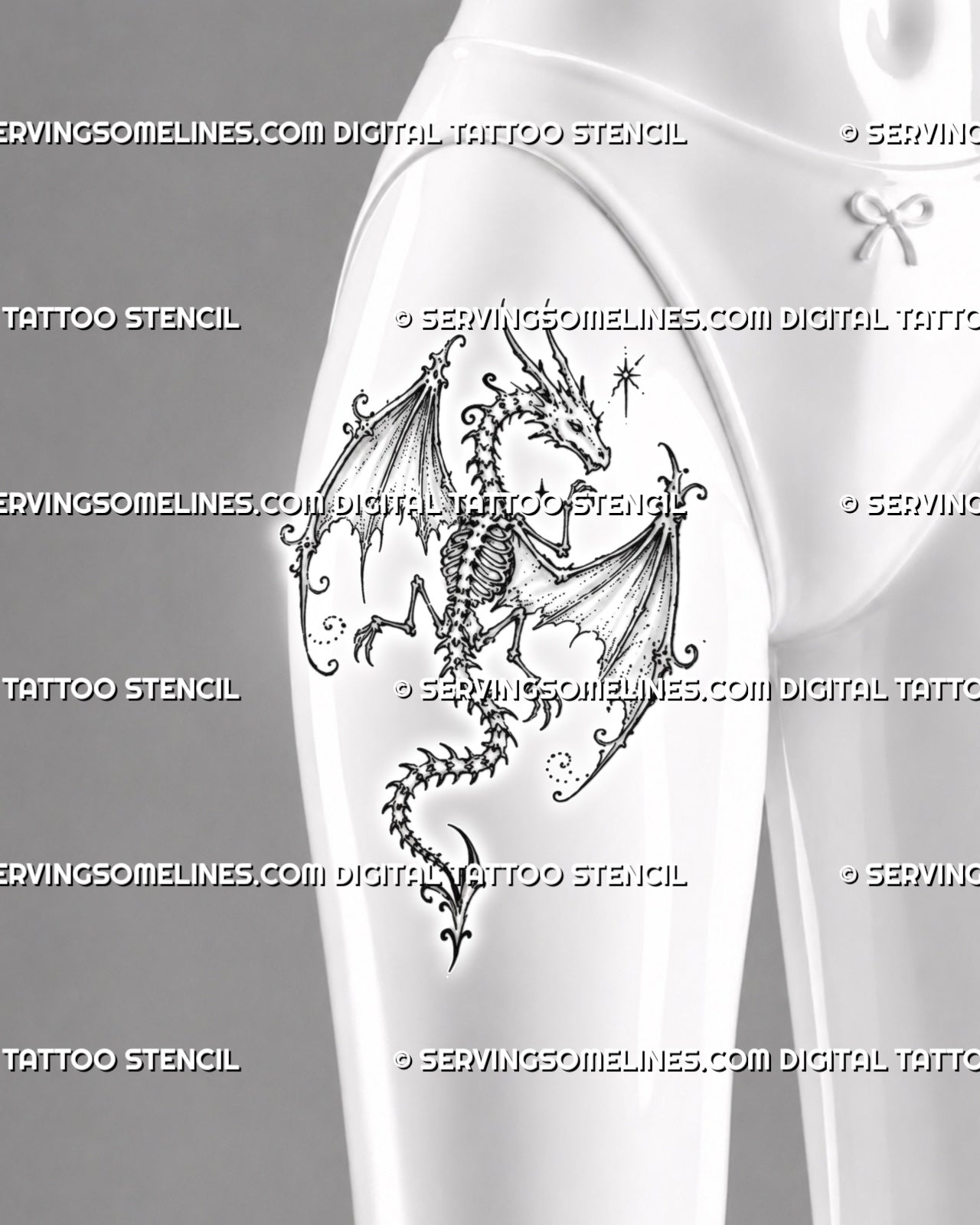 Feminine skeleton dragon tattoo shown on a woman’s thigh with a full winged skeleton, visible ribcage, clawed limbs, curved tail, and delicate fantasy accents