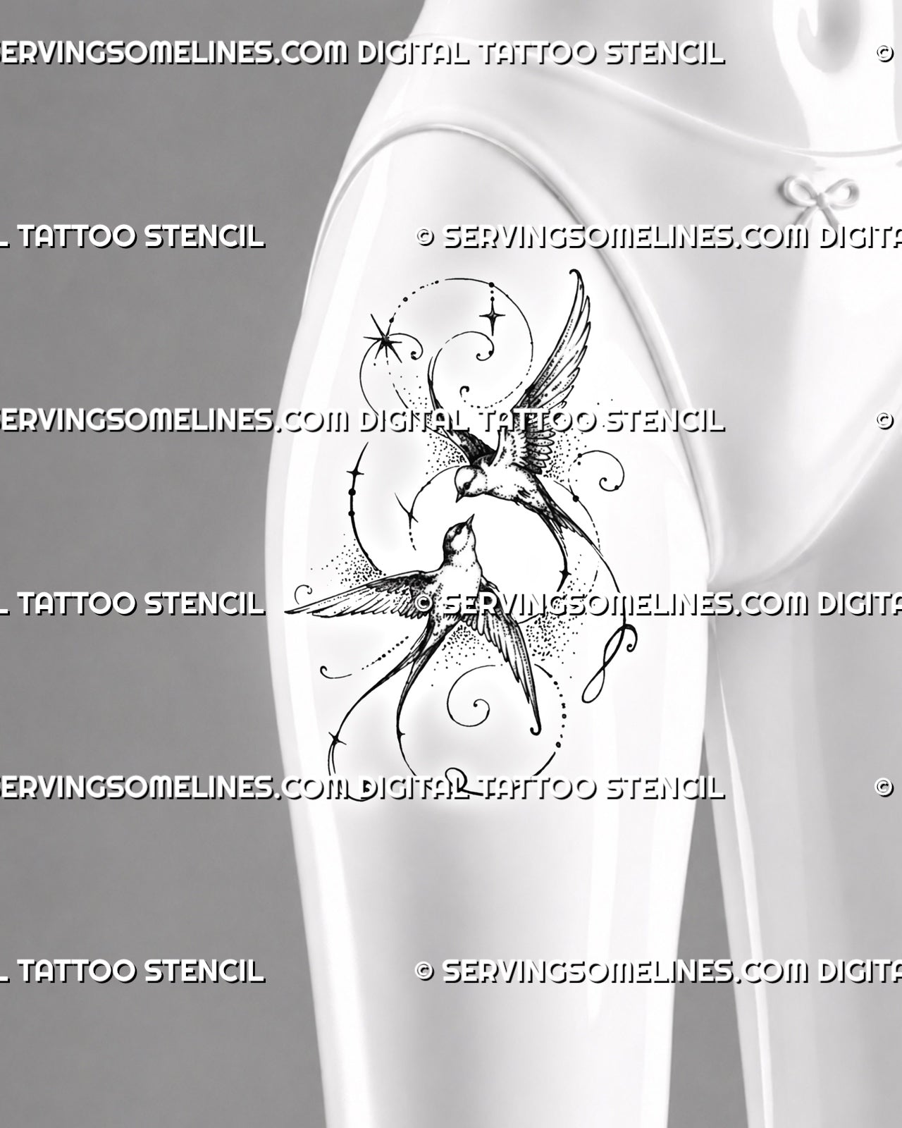 Feminine swallow tattoo shown on a woman’s front thigh with two flying swallows, fine stars, stippled feathers, forked tails, and ornamental curves
