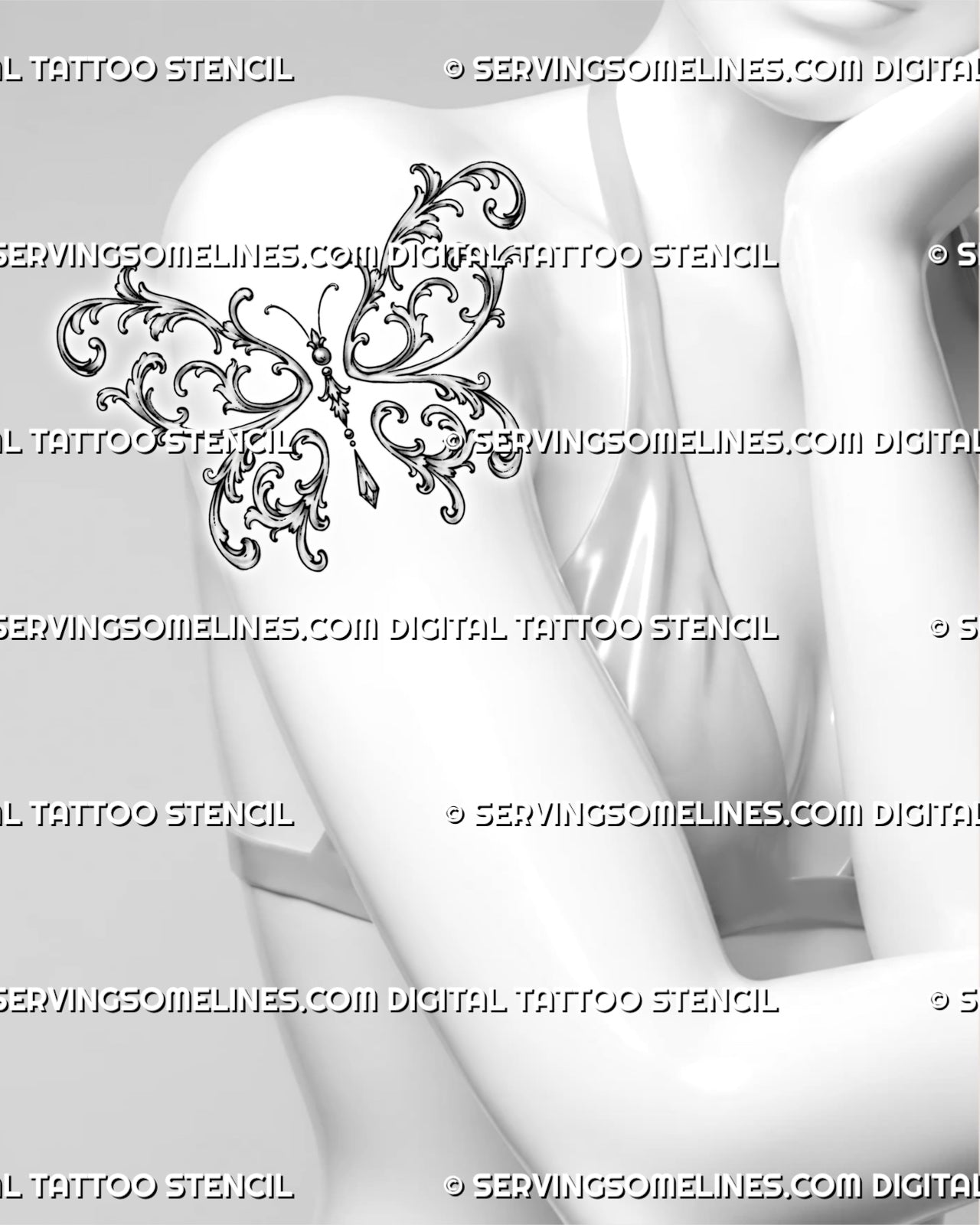 Filigree butterfly tattoo shown on a woman’s upper arm with ornate baroque wings, botanical curls, and a jewelry-inspired pendant