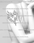 Flame heart tattoo shown on a woman’s upper arm with an open center, rising fire tips, dripping details, and a long tapered flame