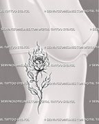 Flaming rose tattoo shown on a woman’s ribs with an open layered bloom, rising fire, flame-shaped leaves, and a curved thorned stem