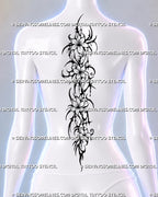 Floral spine tattoo shown on a woman’s center back with four open flowers, flowing dark ornament, sharp black curves, and a long feminine vertical composition