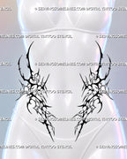 Symmetrical front hip tattoo shown on a woman with black neotribal shapes framing the lower stomach and lighter outlined cybersigilism details