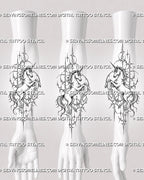 Full-body unicorn tattoo stencil shown on forearm with spiral horn, lifted front legs, sweeping tail, broken circular shapes, and dark cybersigilism linework