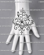 Lily hand tattoo stencil shown on the back of the hand with a central open flower, two buds, mirrored filigree curls, and pointed ornamental accents