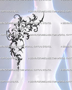 Lily shoulder blade tattoo shown on a woman’s back shoulder and upper arm with trailing ornamental filigree, blackwork foliage, and gothic floral details