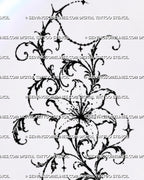 Close-up of lily thigh tattoo design showing curved petals, visible stamens, filigree-inspired curls, dotted black ink, leafy ornament, and open negative space