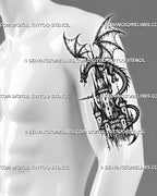 Medieval dragon castle tattoo stencil shown on men’s upper arm with winged dragon, castle tower, pointed rooftops, and arched gate detail