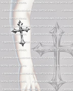 Metallic cross tattoo stencil shown on forearm placement, with shiny chrome effect, dark edges, and readable cross shape