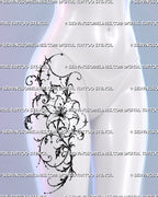 Ornamental lily tattoo shown on a woman’s upper thigh toward the hip with flowing filigree scrollwork, black foliage, star accents, and hanging bead-chain details