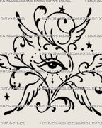 Close-up of ornamental seraphim eye tattoo details showing the central eye, simplified wings, curling scrollwork, small stars, dots, and hand-drawn line variation