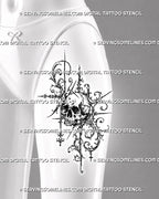 Ornamental skull tattoo shown on women’s thigh with a detailed central skull, open baroque filigree, acanthus curls, and elongated gothic accents