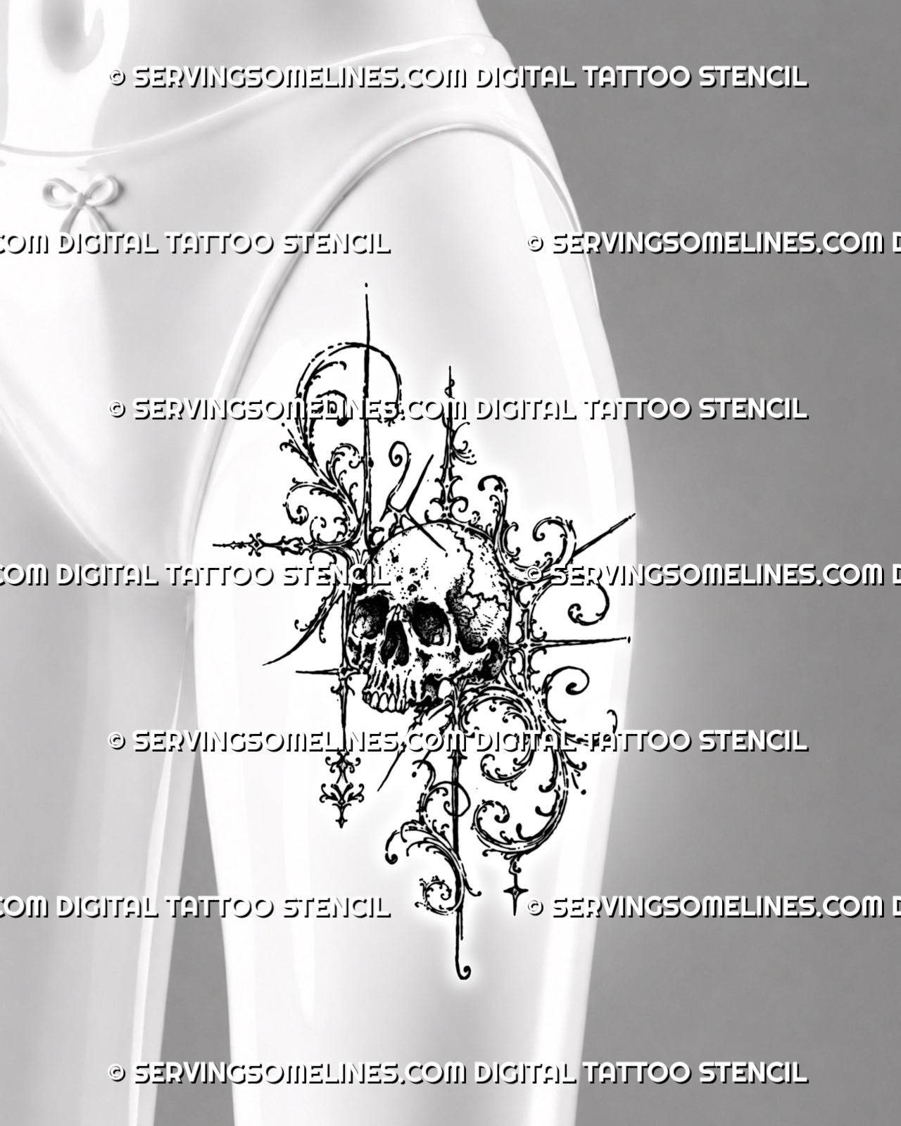 Ornamental skull tattoo shown on women’s thigh with a detailed central skull, open baroque filigree, acanthus curls, and elongated gothic accents