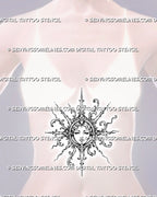 Ornamental sun face tattoo shown at the center of a woman’s stomach with a circular medallion, curling botanical scrollwork, and radiating spear-shaped rays