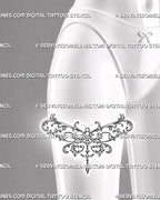 Ornate dragonfly tattoo shown on the front of a woman’s thigh with wide acanthus filigree wings, baroque curls, and jewelry-inspired pendant details