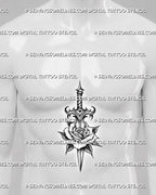 Rose dagger tattoo stencil displayed on men’s stomach center placement, with blade through rose and clean vertical linework