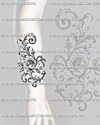 Rose filigree tattoo shown on the forearm with a detailed central rose, vertical baroque scrollwork, pointed ornament, and curved botanical flourishes