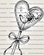 Close-up of candy heart tattoo outline with dotted lollipop texture, bow handle, and small scorpion inside the heart.