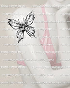 Shattered glass butterfly tattoo shown on women’s arm placement with broken wing detail and sharp shaded texture