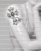 Silver-style cross tattoo shown on womens upper arm placement, with chain detail, pointed ends, and ornamental gothic shape.