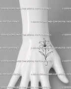Simple lily flower tattoo shown on the hand with an open bloom, curled stamens, a narrow stem, and two small pointed leaves