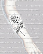 Single rose tattoo stencil shown on forearm placement with long stem, leaf detail, and classic floral linework