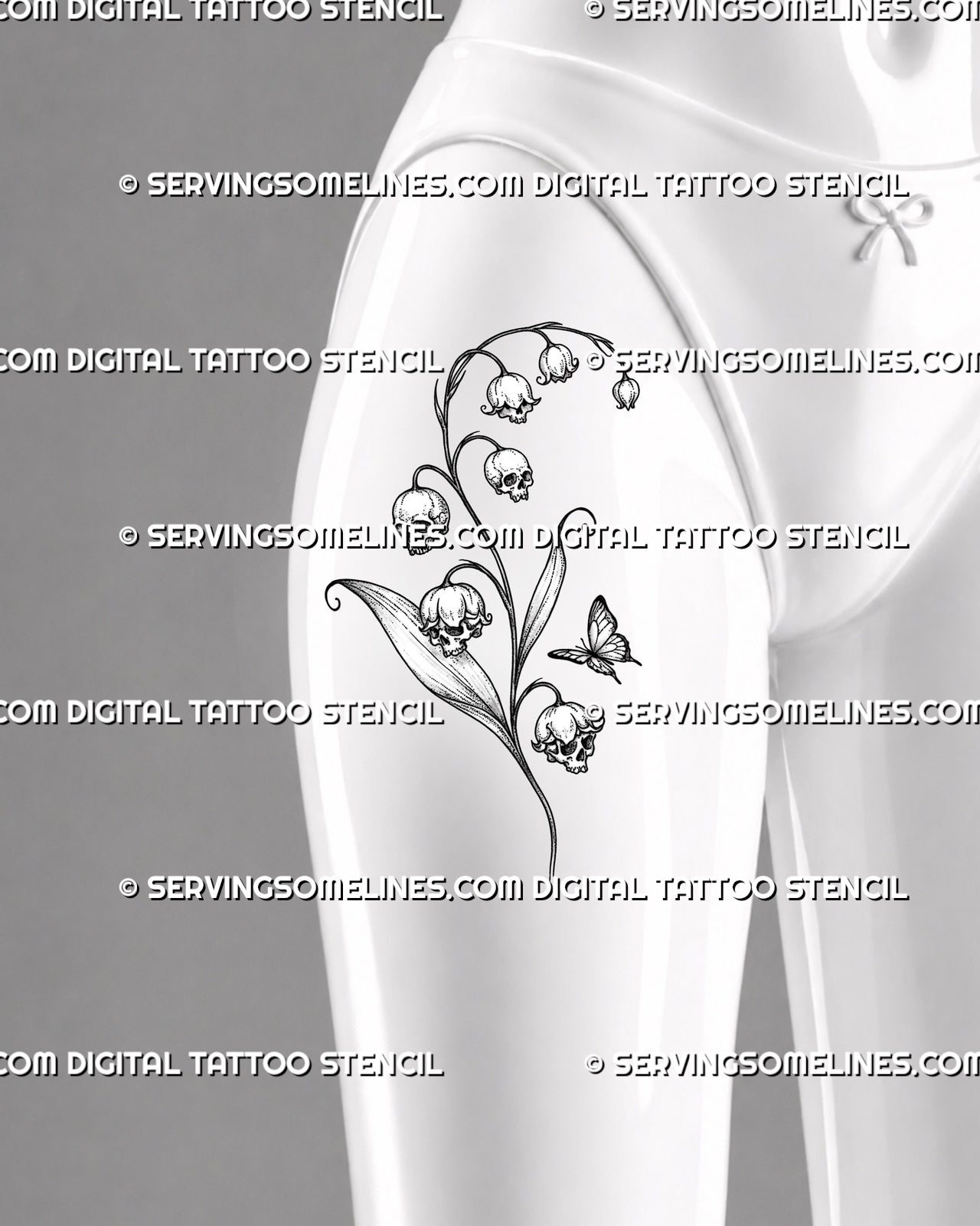 Skull lily of the valley tattoo shown on women’s front thigh with four detailed skull-shaped blooms, arching bell flowers, long leaves, and a butterfly