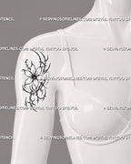 Small cybersigilism flower tattoo stencil shown on women’s shoulder with open flower, sharp sigil details, and simple floral tattoo shape