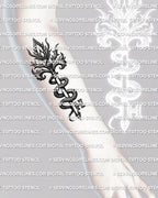 Snake key tattoo stencil shown on forearm placement example, serpent wrapped key with scale texture and sharp tip.